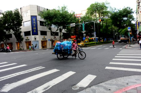 Women with Tricycle Crossing through Intersection of Xinzhong Street and Section 5, Minsheng East Road, Taipei 20150724