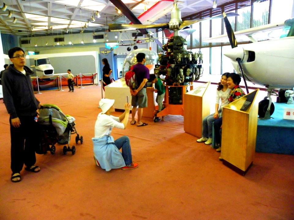 Women Photographing with Cessna 150 in Flight Technology Area 20140330
