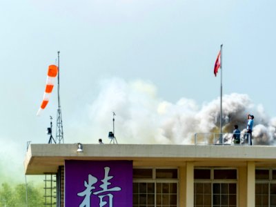 Windsock on Roof of Military Academy Building with Smoke 20140531