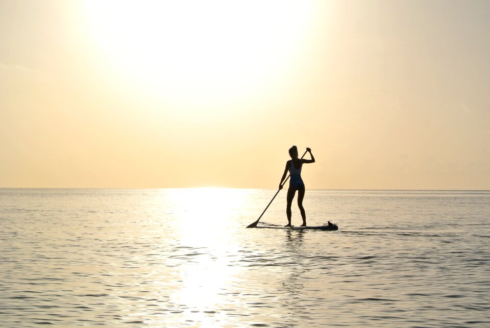 Young woman beach paddleboard