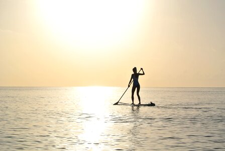 Young woman beach paddleboard