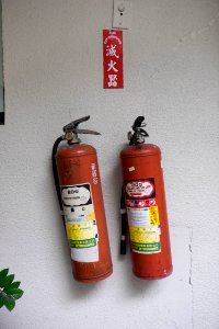 Two Fire Extinguishers Hanged on Wall of New Silicon Valley Business Building B1 Floor Entrance 20141210