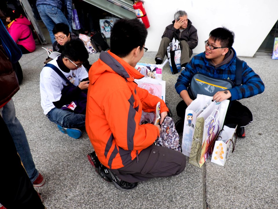 Visitors Sitting on Ground Sharing Collection after Event 20150131