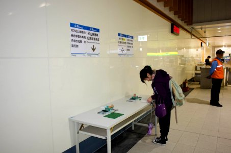 Visitor Stamping Memorial Stamp in Nanjing Sanmin Station at Taipei Metro Songshan Line First Day 20141115