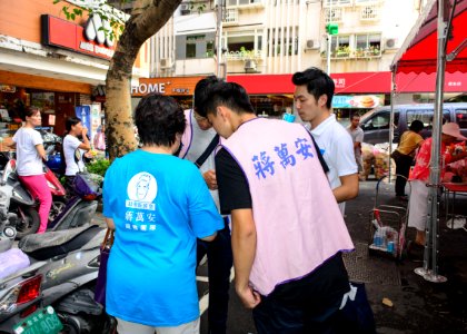 Wan-An Jiang Take a Rest after Greeting Neighbors in Ghost Festival of Futai Village, Songshan District, Taipei 20150822