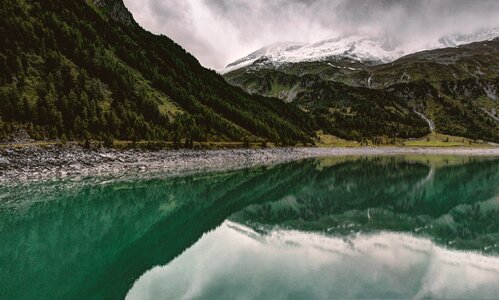 Reservoir mirroring mountain lake photo