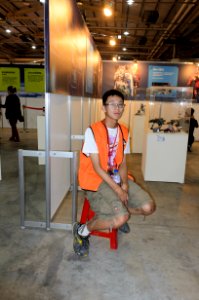 Staff Sitting on Plastic Stool in 2015FFTC 20150801