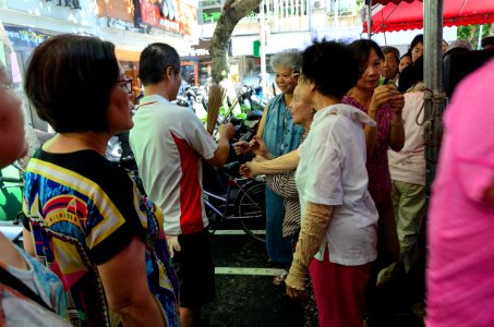 Staff Sending Joss Sticks to Neighbors in Ghost Festival 20160814a