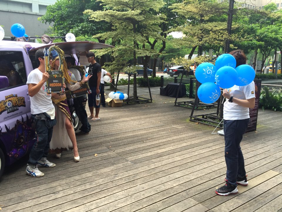 Staff Photographing Player with Female Promotional Model 20160430a