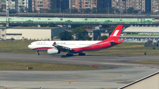 Shanghai Airlines Airbus A330-343X B-6127 Taking off from Taipei Songshan Airport 20150104