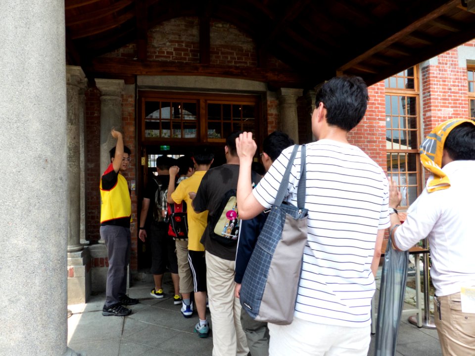 Visitors Showing Seal on Arms before Enter Hall 20140705