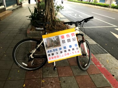 Real Estate Advertisement on Bicycle at Sidewalk of Sanmin Road, Songshan District, Taipei 20180330