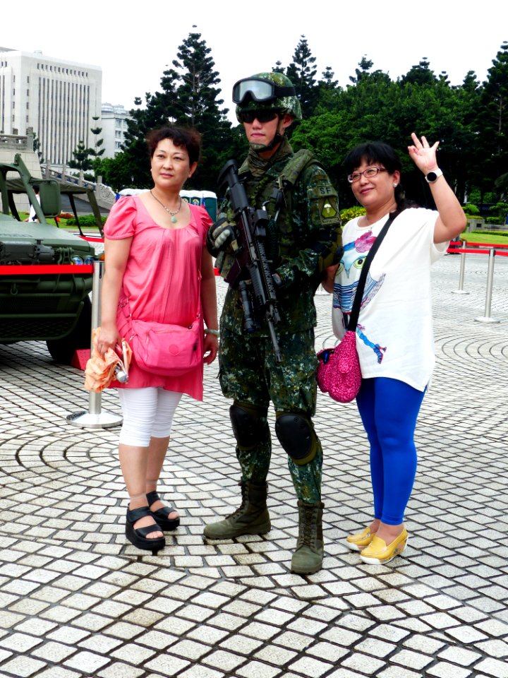 ROC Airborne Special Operations Forces Soldier with Two Women Photographing on Square 20140607