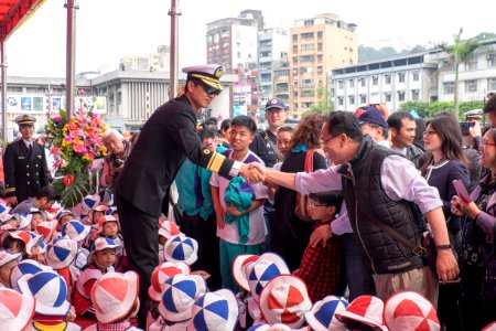 ROCN Officer on Reviewing Stand Handshaking with Visitor 20150316