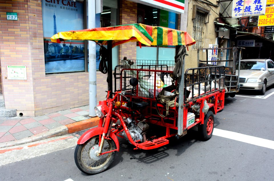 Red Motorized Tricycle Parkd at Jinzhou Street, Taipei 20150901
