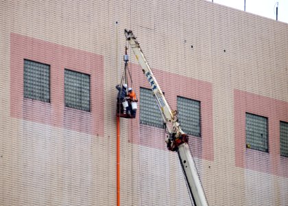 Pipe Workers Working at Out Wall of 13th Floor, Taipei City Minsheng Community Center 20160102a