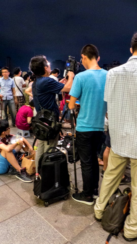 Photographer Adjusting Camera in Rest Time 20140712