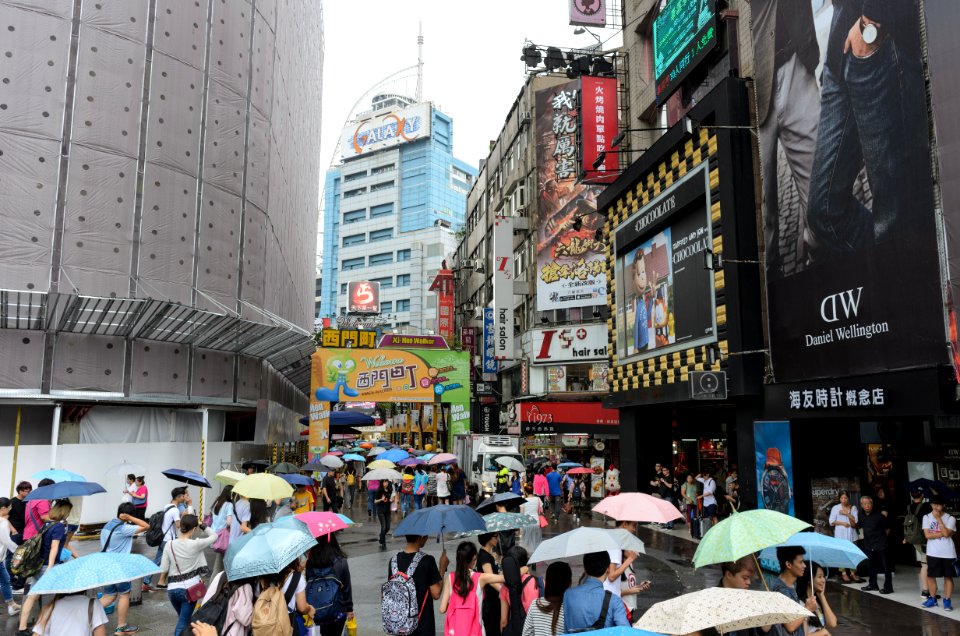 People with Umbrellas Walking into Hanzhong Street, Taipei 20160610