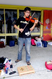 PC Liao Playing Violin in Court of Expo Dome 20150509b