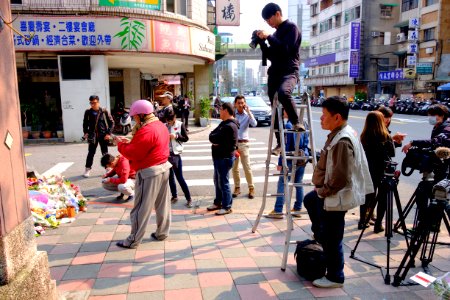 People Photographing Pray Place on Sidewalk 20160330