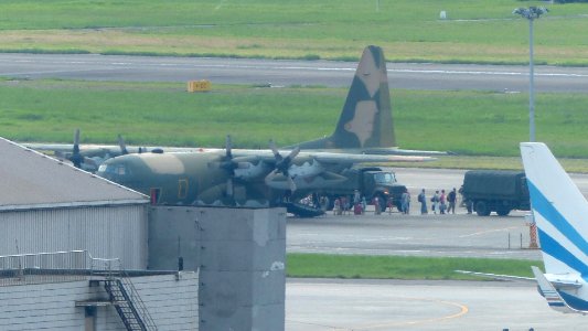 Passengers Leave ROCAF C-130H 1302 and Aboarding Military Trucks 20140821