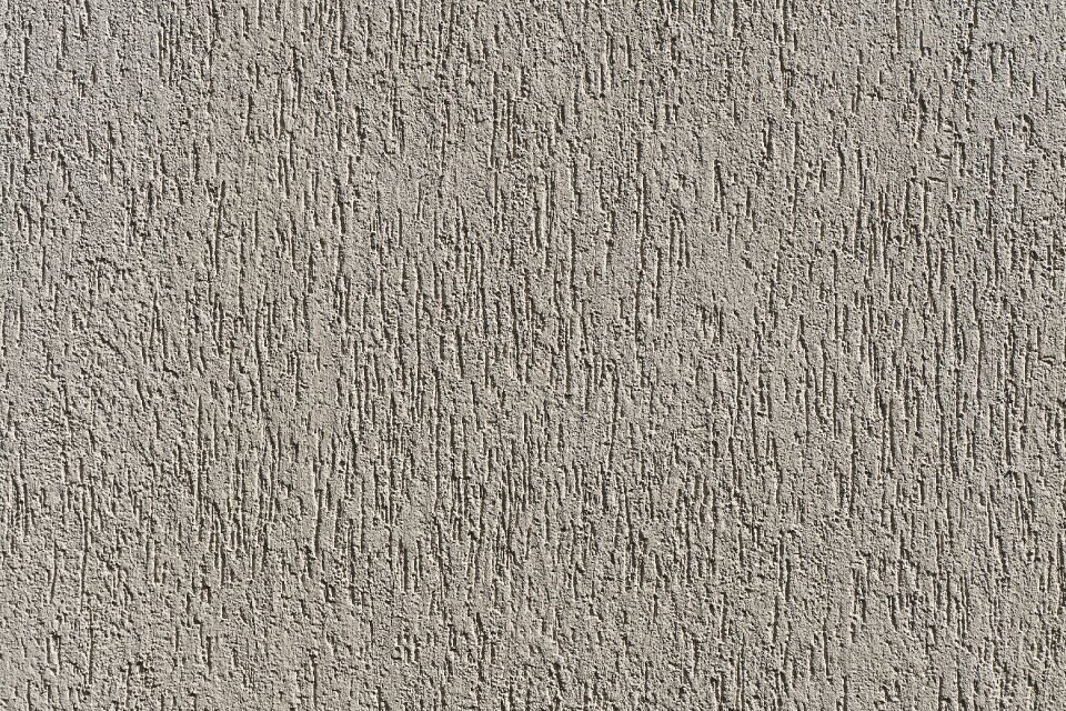 Scratch plaster textured plaster wall