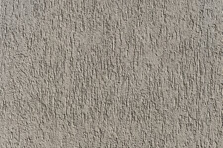 Scratch plaster textured plaster wall