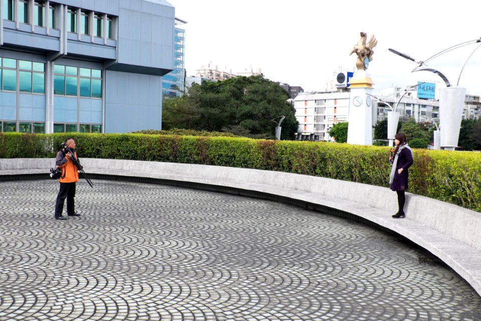 Television Camera Photographer and Female News Reporter of Phoenix Television Stand by in Front Court of Civil Aeronautics Administration, MOTC 20150210