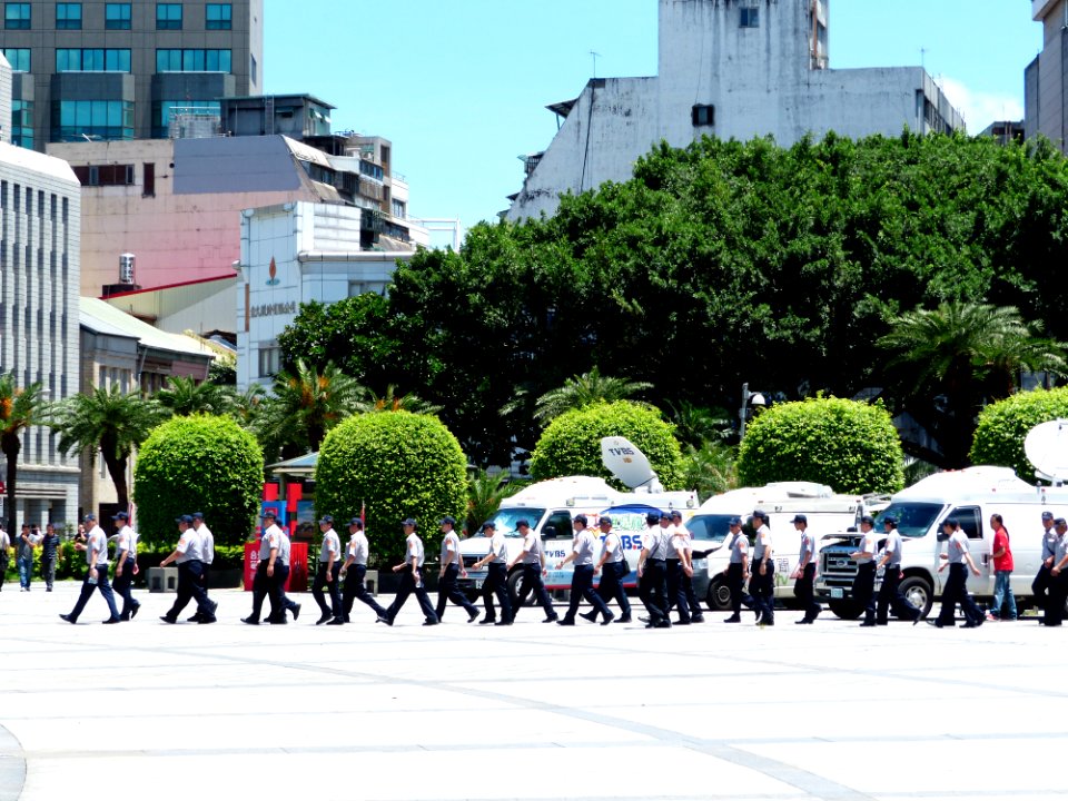 TCPD Policemen Walking across Zhongshan Hall Square in Noon 20140707
