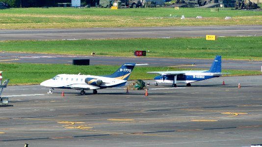 Sunrise Airlines Raytheon Hawker 400XP B-77701 and Roc Aviation Britten Norman BN-2B-20 Islander B-68802 Parked at Taipei Songsham Airport 20160821