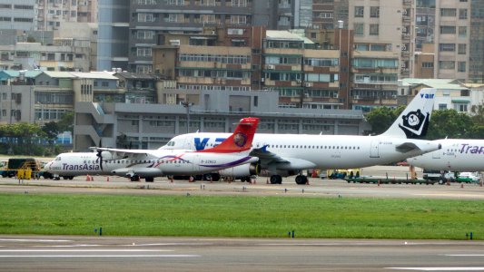 TransAsia Airways ATR 72-212A B-22823 and Former V Air A320-232 B-22316 at Taipei Songshan Airport 20161124