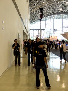 TIBS South Hall Staff Moving Camera on High-legs Tripod for Photographing 20140508