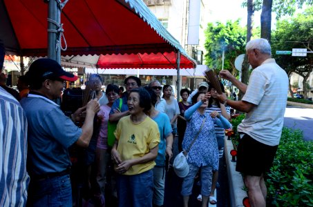 Staff Sending Joss Sticks to Neighbors in Ghost Festival 20160814b