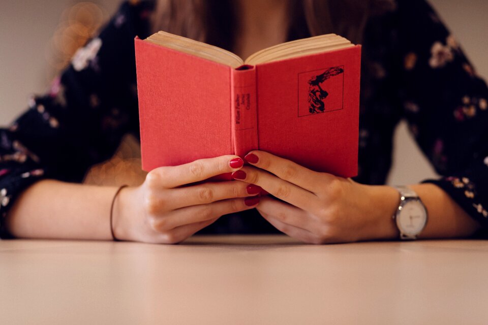 Reading book hand