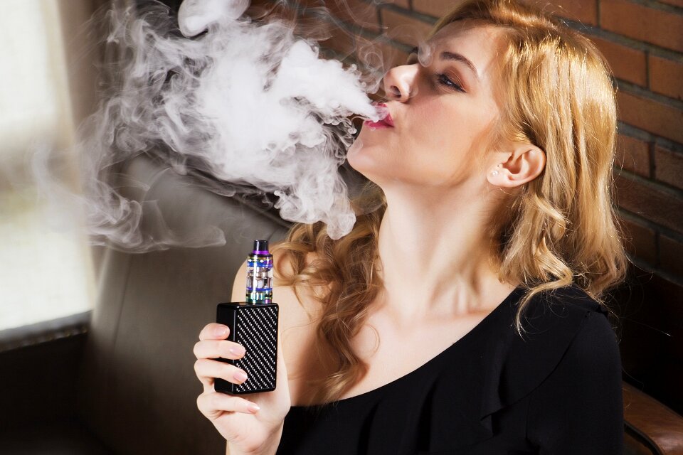 Electronic cigarette smoke brick wall photo