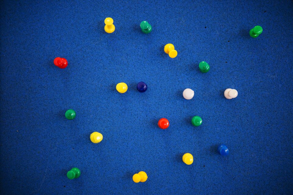 Pins thumbtacks blue board