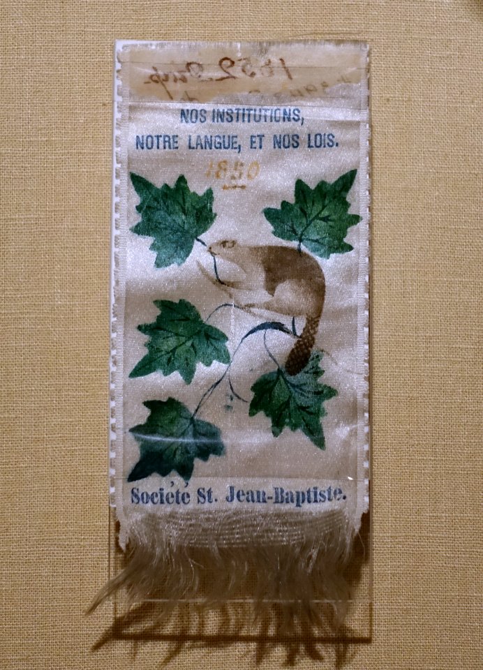 Rosette of the Societe Saint-Jean-Baptiste, 1850, silk - Château Ramezay - Montreal, Canada - DSC07530