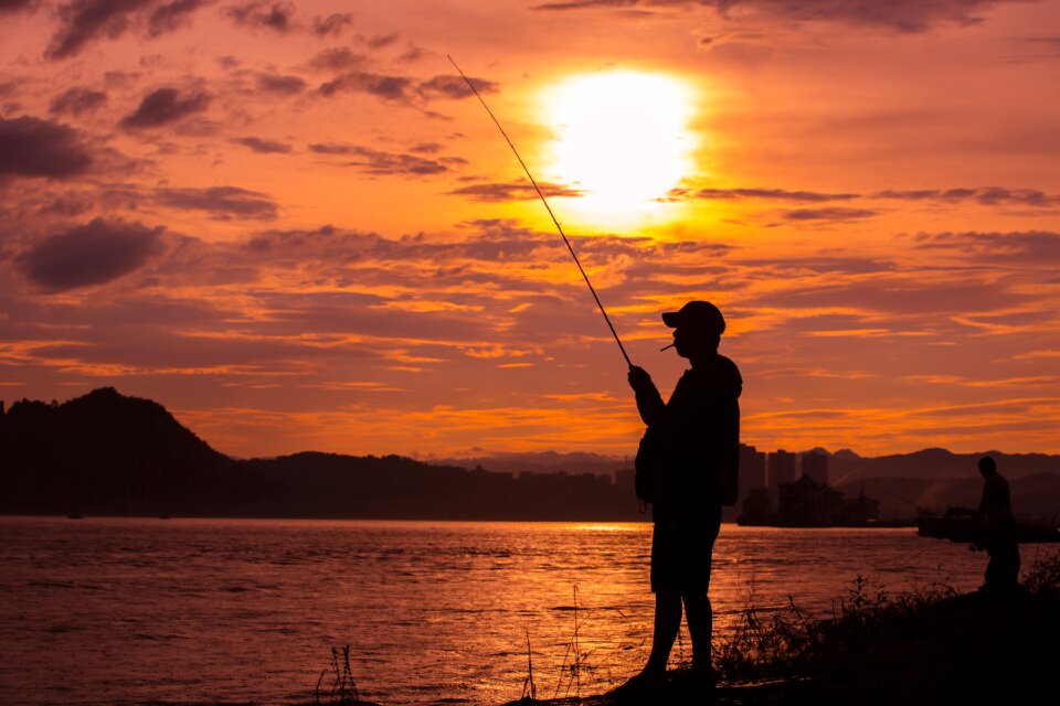 Fishing people silhouette yichang riverside