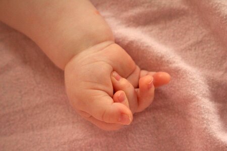 Baby birth hands photo