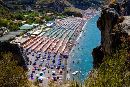 Vacationers beach umbrellas
