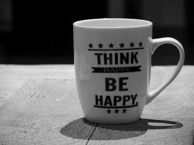 Positive thinking cup black white photo