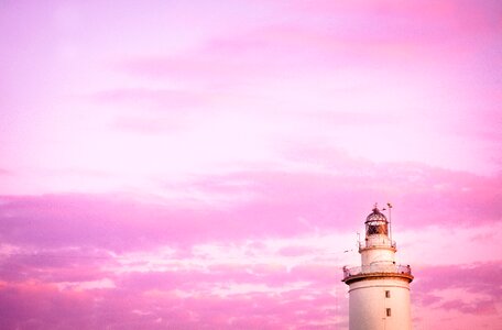 Sunset lighthouse pink sky photo