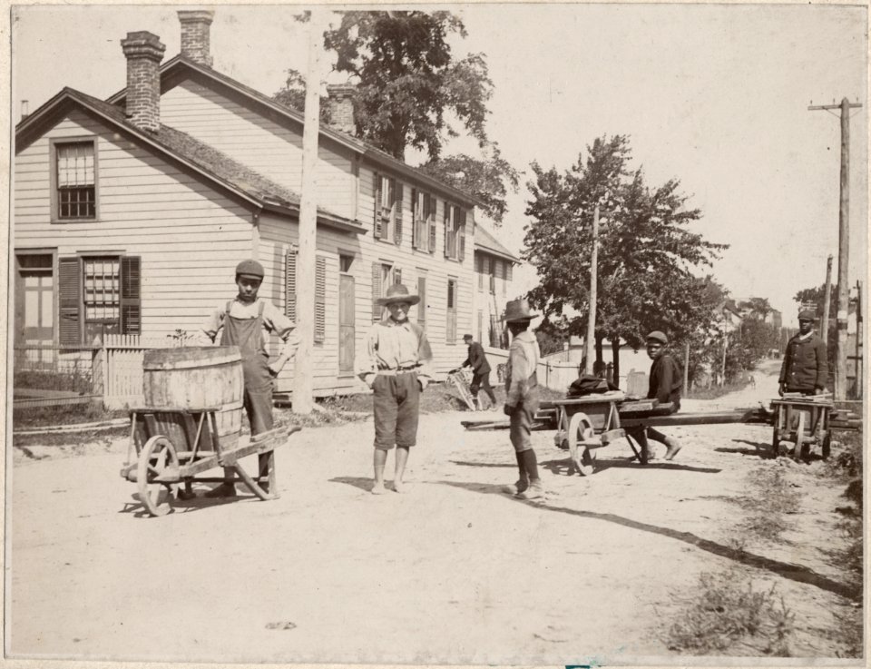 Boys with wheelbarrows in the streets of Amherstburg, Onta… photo