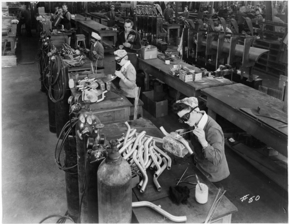 Women working in the welding room, welding and riveting, a…