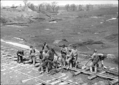 Men building a railway track photo