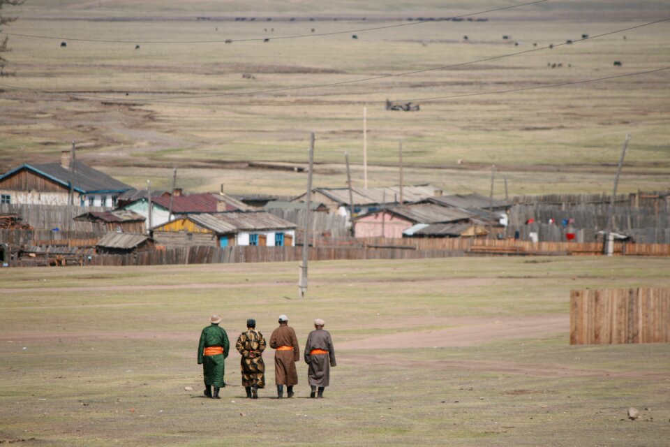 Mongolian men hiking mongolian views
