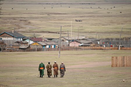 Mongolian men hiking mongolian views