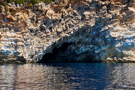 Greek island cliff cave