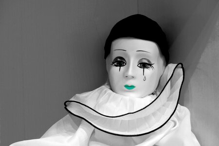 Porcelain figurine portrait sad clown photo