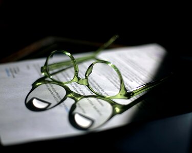 Eyeglasses reflection dark photo